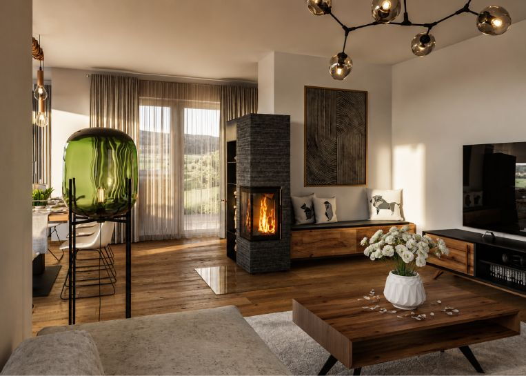 Gesamtansicht eines modernen Eck-Kaminofens mit dunkler Natursteinverkleidung, schwarzem Stahlanbau und angrenzendem Sitz-Lowboard.